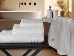 500GSM towel folded on bed — Soft Touch Linens NI hospitality supply
